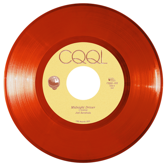Clear red vinyl record with a yellow label on a white background