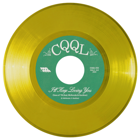 Clear yellow color vinyl record with green label on a white background