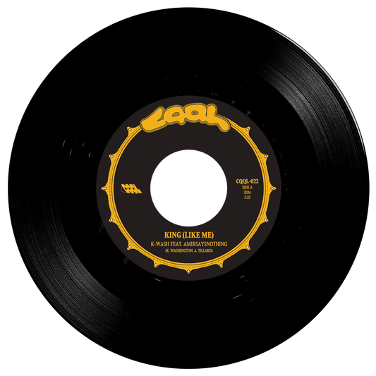 Black vinyl record with a gold label on a white background