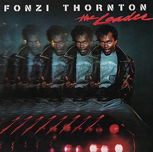 Album cover with a person in a leather jacket sitting on a car, surrounded by reflections.